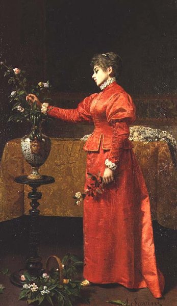 Woman arranging a vase of flowers