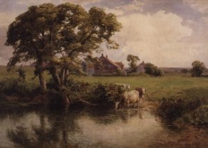 Cattle watering near a farmhouse