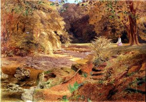 Lady by a rocky stream