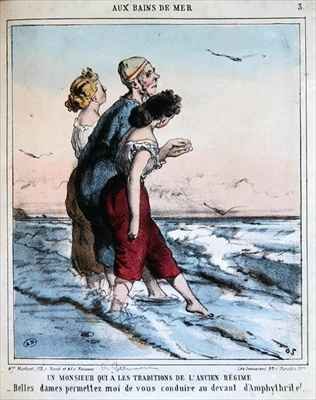 Traditional man escorting two young ladies to bathe in the sea