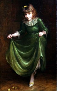 Portrait of a young girl in a green dress